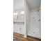 Bathroom featuring double vanity and white tiled shower at 225 Highway 212 S, Covington, GA 30014