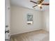 Bedroom featuring a ceiling fan, neutral carpet, and a window view at 225 Highway 212 S, Covington, GA 30014