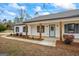 Inviting front porch with wooden columns and a stylish front door at 225 Highway 212 S, Covington, GA 30014