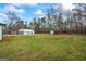 Exterior view of detached three-car garage on expansive property at 225 Highway 212 S, Covington, GA 30014