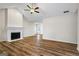 Bright living room with a fireplace, vaulted ceilings, and hardwood floors at 225 Highway 212 S, Covington, GA 30014