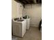 Laundry room area with a new white washer and dryer at 1125 Carlo Sw Ct, Atlanta, GA 30331