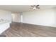 Large living room featuring hardwood floors, a ceiling fan, and plenty of open space at 1033 Claas Way, Locust Grove, GA 30248