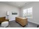 Bright office featuring modern wood desk, neutral walls, plush carpeting and a large window at 1033 Claas Way, Locust Grove, GA 30248