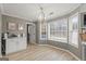 Bright breakfast nook featuring ample windows and natural light, complemented by a stylish chandelier at 234 Thorne Wood Lane, Hampton, GA 30228