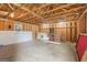 Spacious unfinished garage with exposed beams and studs offers endless possibilities for storage or workspace at 234 Thorne Wood Lane, Hampton, GA 30228