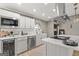 Modern kitchen with stainless steel appliances, a wine cooler, and marble countertops at 234 Thorne Wood Lane, Hampton, GA 30228