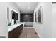 A modern bathroom is equipped with a double vanity, stylish tub, and a tiled shower at 567 Middle Sw St, Atlanta, GA 30310