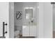 Modern half bath featuring white cabinets, clean lines, and contemporary fixtures at 567 Middle Sw St, Atlanta, GA 30310