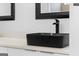 Close-up of a contemporary bathroom sink with black faucet and waterfall feature at 567 Middle Sw St, Atlanta, GA 30310