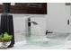 The bathroom sink features a waterfall faucet and is adorned with decor at 567 Middle Sw St, Atlanta, GA 30310