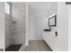 Modern bathroom with a tiled shower and a floating vanity with a sleek black faucet at 567 Middle Sw St, Atlanta, GA 30310