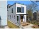 Modern home with a rooftop deck, minimalist railings and a cozy covered front porch at 567 Middle Sw St, Atlanta, GA 30310