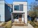 Modern home featuring a rooftop deck and a charming front porch with minimalist railings at 567 Middle Sw St, Atlanta, GA 30310