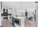 Bright, modern kitchen with stainless steel appliances, white cabinets, a large island, and an open floor plan at 567 Middle Sw St, Atlanta, GA 30310