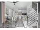 Open-concept living room with stairs, a modern kitchen, and contemporary decor at 567 Middle Sw St, Atlanta, GA 30310