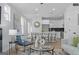 Bright living room with modern decor flowing into a stylish kitchen with bar seating at 567 Middle Sw St, Atlanta, GA 30310