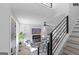 Bright living room with contemporary furniture, fireplace, and staircase with black railings at 567 Middle Sw St, Atlanta, GA 30310