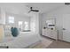 An airy bedroom showcases a bed, dresser, and outdoor access through french doors at 567 Middle Sw St, Atlanta, GA 30310