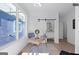 Bright office space with a modern desk, globe, and barn door to bathroom, offers a stylish work-from-home setting at 567 Middle Sw St, Atlanta, GA 30310
