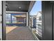 Inviting covered patio with a ceiling fan and stylish tiled flooring at 567 Middle Sw St, Atlanta, GA 30310