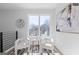 Cozy sitting area with white chairs, table and modern artwork, perfect for relaxation at 567 Middle Sw St, Atlanta, GA 30310