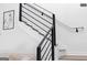 Modern staircase with black metal railings, and wooden steps at 567 Middle Sw St, Atlanta, GA 30310