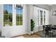 Bright and airy dining room featuring modern light fixture, French doors and large windows with backyard views at 0 Lot 2 Mcbride Rd, Fayetteville, GA 30215