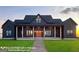 Inviting two-story modern farmhouse with charming front porch and large manicured lawn at 0 Lot 2 Mcbride Rd, Fayetteville, GA 30215