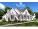 Inviting two-story modern farmhouse with charming front porch and lush landscaping at 0 Lot 2 Mcbride Rd, Fayetteville, GA 30215