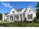 Inviting two-story modern farmhouse with charming front porch and lush landscaping at 0 Lot 2 Mcbride Rd, Fayetteville, GA 30215