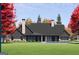 Back of house with dark siding, covered patio, and a beautiful green lawn at 0 Ebenezer Church Rd # 3, Fayetteville, GA 30215