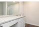 Bathroom vanity features white cabinetry, granite countertop and a large mirror at 1013 Claas Way, Locust Grove, GA 30248