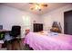 Bedroom with a bed and decor, featuring laminate floors and natural light at 3266 Greenhill Ct, Villa Rica, GA 30180