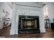 Close up of the fireplace with a marble surround and wooden floors at 3266 Greenhill Ct, Villa Rica, GA 30180