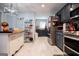 Modern kitchen with stainless appliances and black cabinets at 3266 Greenhill Ct, Villa Rica, GA 30180