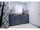 Kitchen with a marble floor, blue cabinets, white walls, and a window at 3266 Greenhill Ct, Villa Rica, GA 30180