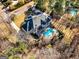 Bird's-eye view of an estate, highlighting the pool, patio, and manicured lawns at 709 Prestige Pt, Peachtree City, GA 30269