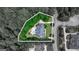 Aerial view of the property showcasing the home's footprint, pool, and surrounding greenery at 709 Prestige Pt, Peachtree City, GA 30269
