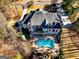 Beautiful aerial view of a large home with a swimming pool, deck, and backyard at 709 Prestige Pt, Peachtree City, GA 30269