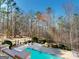 Enjoy the outdoors with a refreshing backyard pool and serene wooded surroundings at 709 Prestige Pt, Peachtree City, GA 30269