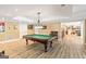 Finished basement rec room with a pool table, seating area, and views to the backyard at 709 Prestige Pt, Peachtree City, GA 30269