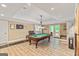 Basement rec room featuring a pool table and access to the backyard at 709 Prestige Pt, Peachtree City, GA 30269