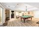Basement rec room features a pool table and access to the home theater at 709 Prestige Pt, Peachtree City, GA 30269
