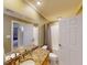 Bathroom featuring granite countertops, double sink vanity, and neutral decor at 709 Prestige Pt, Peachtree City, GA 30269