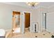 Elegant bathroom showcasing a glass shower, bathtub, and access to a toilet room and closet at 709 Prestige Pt, Peachtree City, GA 30269
