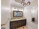 Modern bathroom with granite counters, vanity mirror, and updated lighting at 709 Prestige Pt, Peachtree City, GA 30269