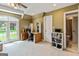 Bright bedroom includes large window, ceiling fan, and en-suite bathroom at 709 Prestige Pt, Peachtree City, GA 30269