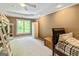 Bedroom includes a bed, a window offering natural light, and built in storage at 709 Prestige Pt, Peachtree City, GA 30269