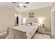 Comfortable bedroom features a ceiling fan, neutral walls, and closet at 709 Prestige Pt, Peachtree City, GA 30269